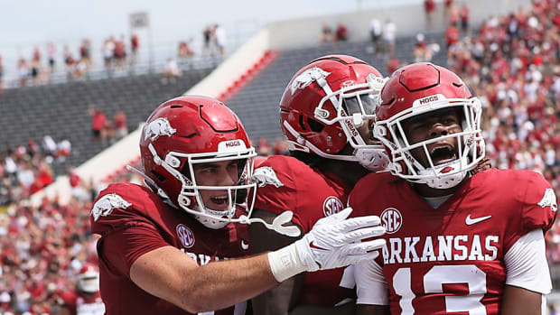 Arkansas Razorbacks wide receiver Jaedon Wilson celebrates with tight end Luke Hasz after scoring a touchdown in the first quarter against the Western Carolina Catamounts at War Memorial Stadium.